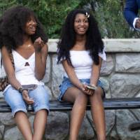 faculty sitting on bench